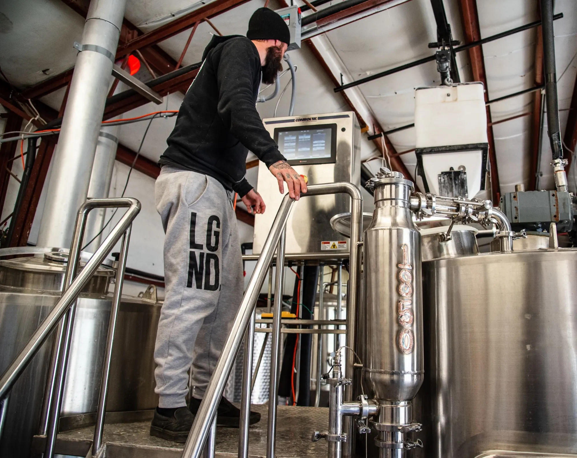 A brewer working among tanks in the 1850 brewhouse